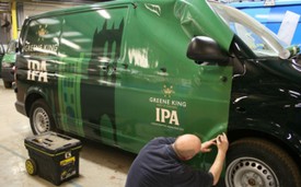 Vehicle wrap being applied to Greene King van at Bri-Stor's in-house graphics department