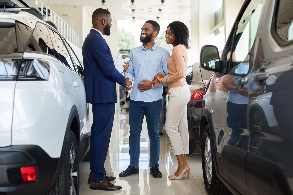 car purchase happy customers couple handshaking w 2022 01 19 00 11 51 utc